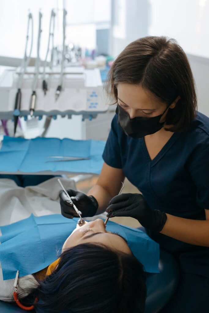 The Art of Drawing Readers In: Your attractive post title goes here Dentist performing dental care procedure on patient in clinic setting.