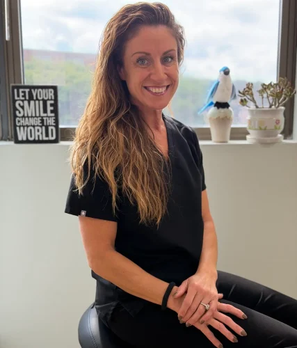 Ericka the dental assistant sitting by the window